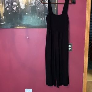Black stretchy wide leg romper with pockets